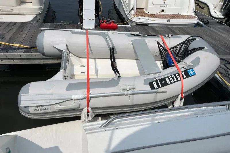 Slide: The Image of Inflatable Zodiac boat docked beside a 1997 Formula 34 Performance Cruiser. - 27