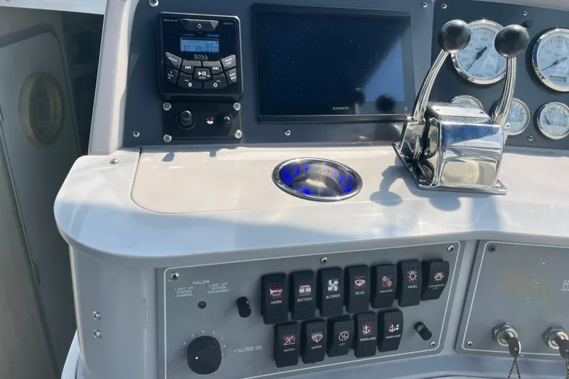 Slide: The Image of Control panel of a 1997 Formula 34 Performance Cruiser with gauges and switches. - 18