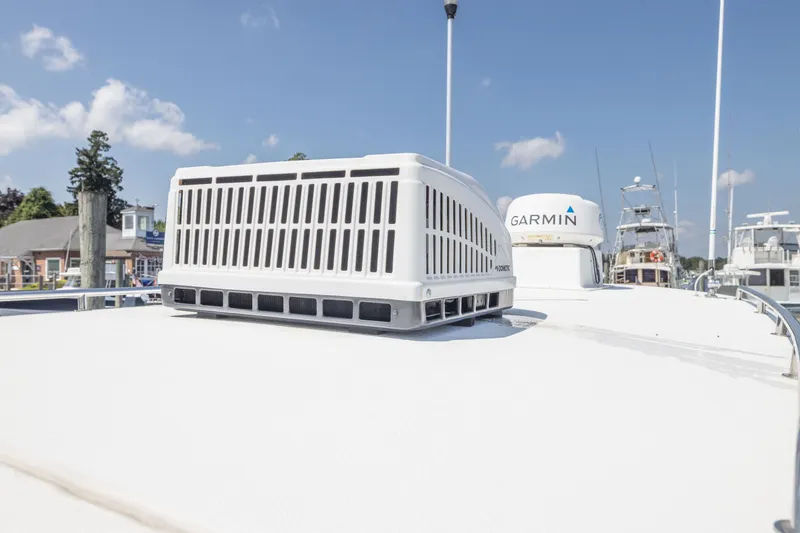 Slide: The Image of 2019 Rosborough 246 Halifax boat with Garmin equipment on deck, docked under blue sky. - 13
