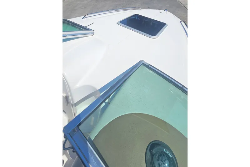 Slide: The Image of 2003 Chaparral 215 SS boat deck with windshield and hatch. - 16