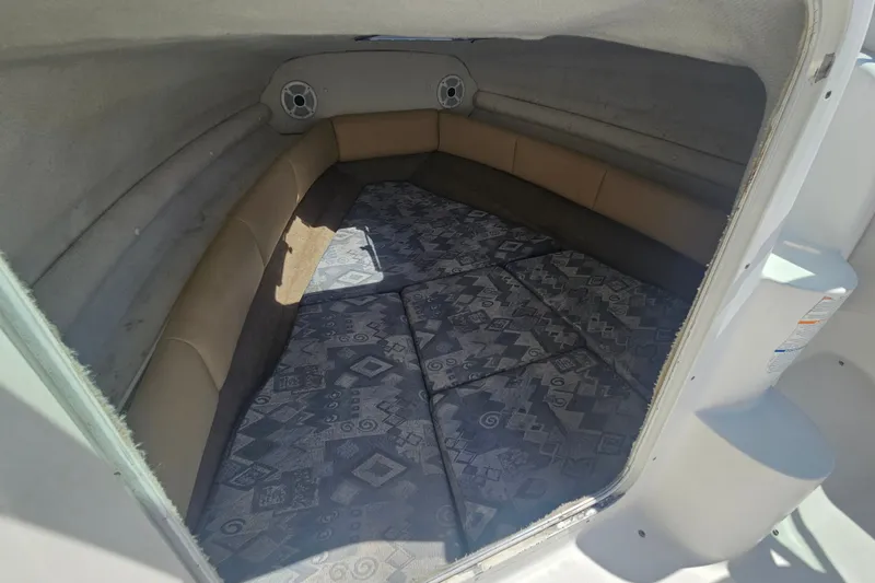 Slide: The Image of Interior cabin of a 2003 Chaparral 215 SS boat with patterned cushions. - 15