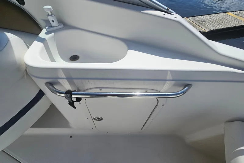 Slide: The Image of 2003 Chaparral 215 SS boat sink with chrome handle, dockside view. - 9