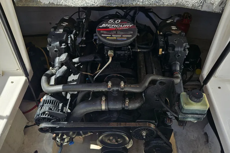 Slide: The Image of 2003 Chaparral 215 SS boat engine, featuring a 5.0 Mercury motor. - 14