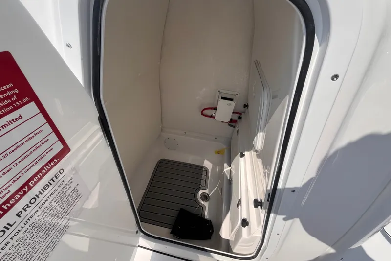 Slide: The Image of Interior view of 2027 Tidewater 232 LXF boat compartment with safety instructions. - 11