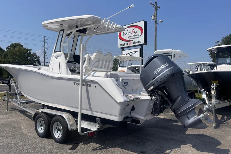 Slide: The Image of 2027 Tidewater 232 LXF boat with Yamaha engine on trailer at Marker 17 Marine. - 2