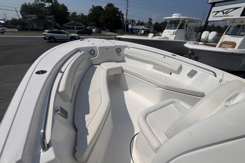 Slide: The Image of 2027 Tidewater 232 LXF boat interior with white seating and modern design. - 10