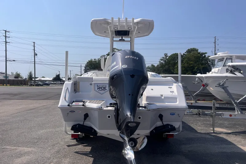 Slide: The Image of 2027 Tidewater 232 LXF boat with Yamaha 250 engine, parked outdoors. - 3