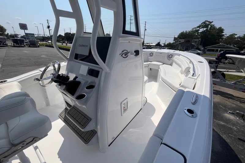 Slide: The Image of 2027 Tidewater 232 LXF boat interior with Garmin navigation, sleek design, and comfortable seating. - 14