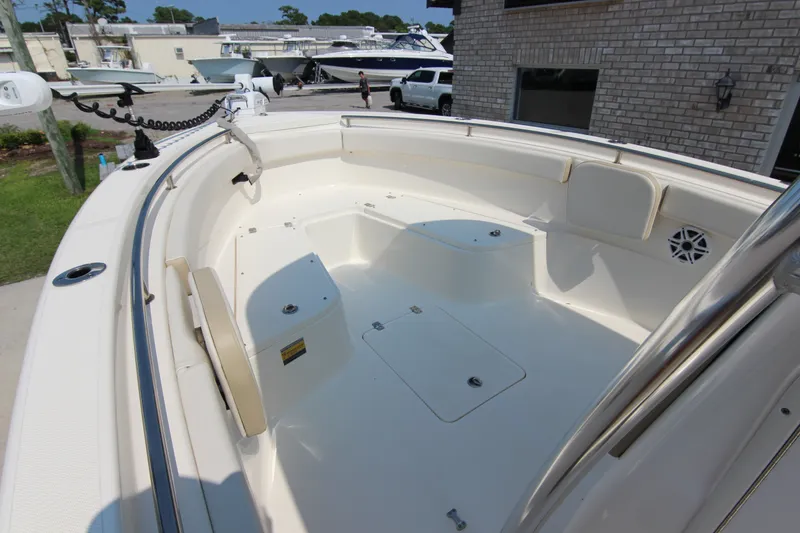 Slide: The Image of 2024 Bulls Bay 255 Center Console boat interior with spacious seating and storage compartments. - 26