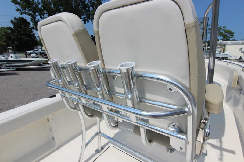 Slide: The Image of 2024 Bulls Bay 255 Center Console boat with rod holders and cushioned seating. - 18