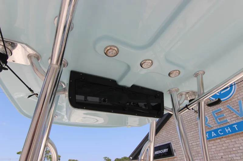 Slide: The Image of 2024 Bulls Bay 255 Center Console boat's T-top with mounted electronics and lighting. - 23