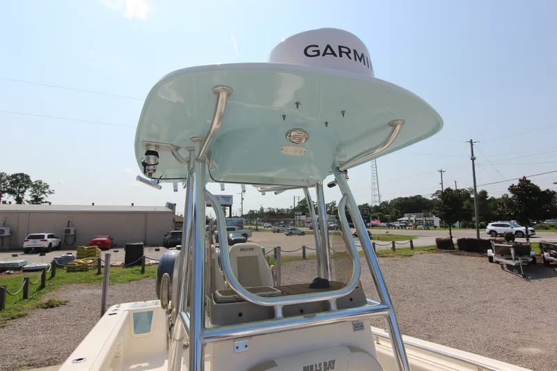 Slide: The Image of 2024 Bulls Bay 255 Center Console boat with Garmin equipment, parked outdoors. - 34
