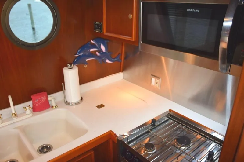 Slide: The Image of Custom galley with molded countertop/sink and stainless appliances and splash panels - 18
