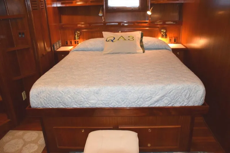 Slide: The Image of Comfortable berth with reading light and drawer storage beneath and in nightstand to either side of the bed - 50