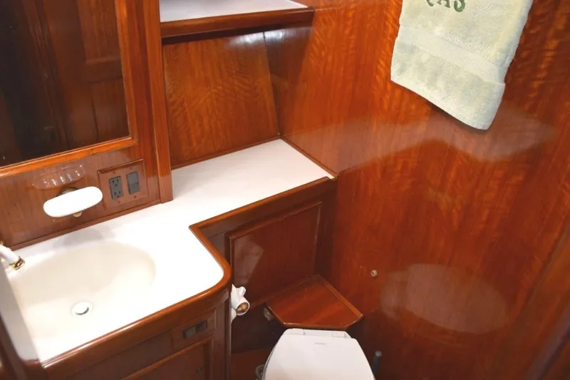 Slide: The Image of Guest head also has second door from companionway. Molded vanity top and new freshwater head - 61