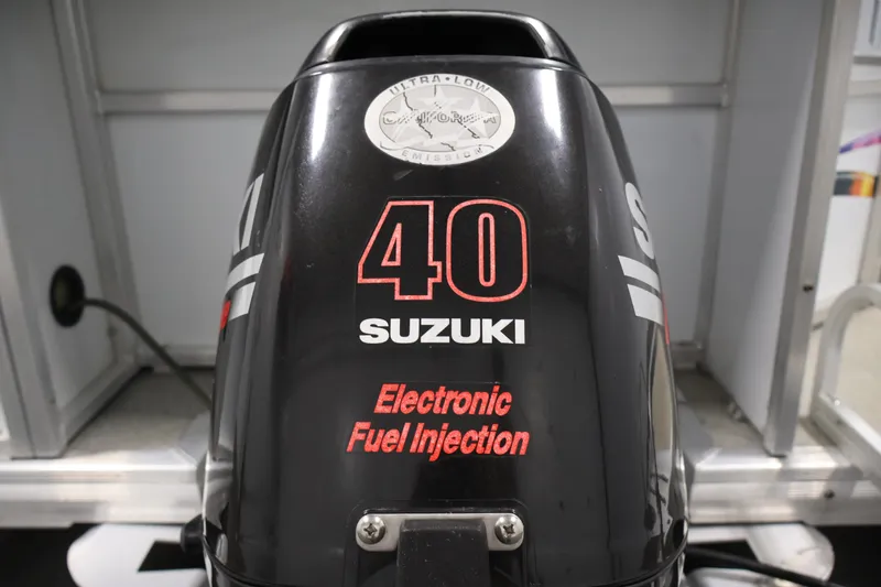 Slide: The Image of Suzuki 40 horsepower outboard motor with electronic fuel injection on a 2009 Leisurecraft 22 Cruise. - 40