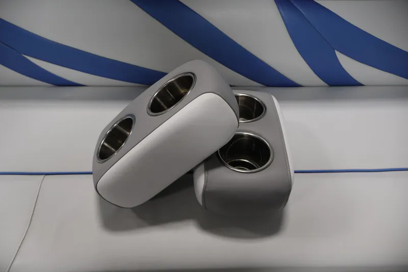 Slide: The Image of Cup holders on Leisurecraft 22 Cruise boat seat, 2009 model, with blue and gray upholstery. - 16