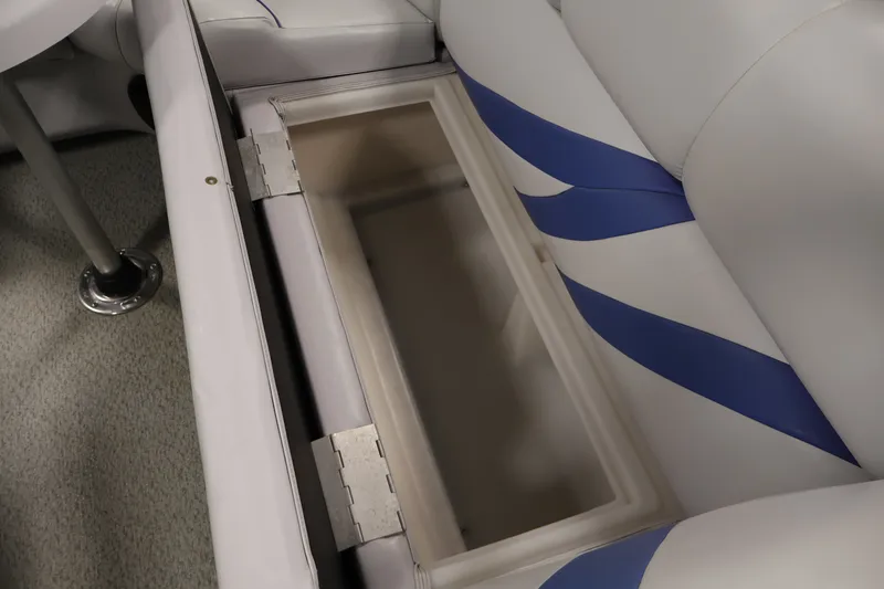 Slide: The Image of Open storage compartment in 2009 Leisurecraft 22 Cruise boat with blue and white seating. - 33