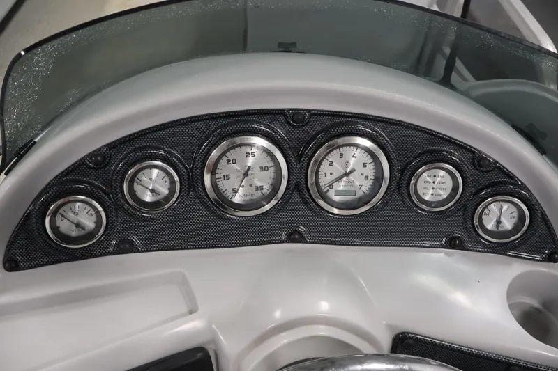 Slide: The Image of Dashboard of a 2009 Leisurecraft 22 Cruise boat with multiple gauges and controls. - 24