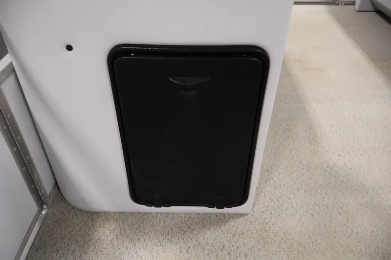 Slide: The Image of Black storage compartment on 2009 Leisurecraft 22 Cruise boat interior. - 19