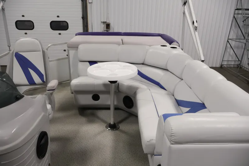 Slide: The Image of Interior of 2009 Leisurecraft 22 Cruise boat with white and blue seating. - 30