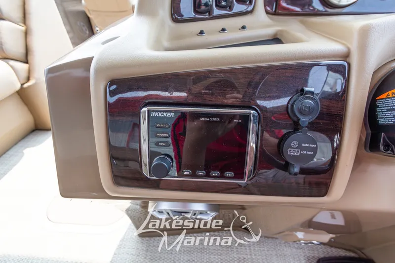 Slide: The Image of Dashboard of a 2017 Bennington 22 GFS boat featuring a Kicker media center. - 29