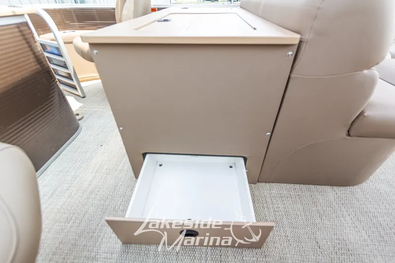 Slide: The Image of 2017 Bennington 22 GFS boat interior with open storage compartment, Lakeside Marina branding. - 36