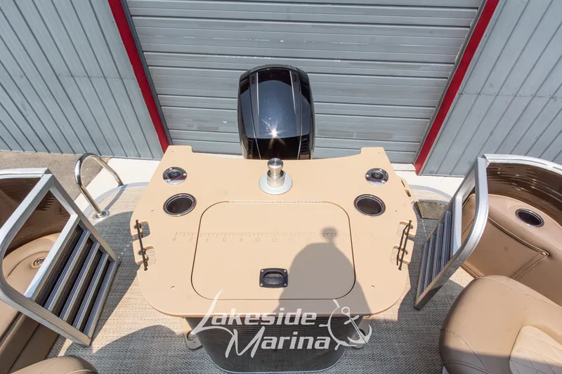 Slide: The Image of 2017 Bennington 22 GFS boat interior with fishing station and motor, Lakeside Marina branding. - 39