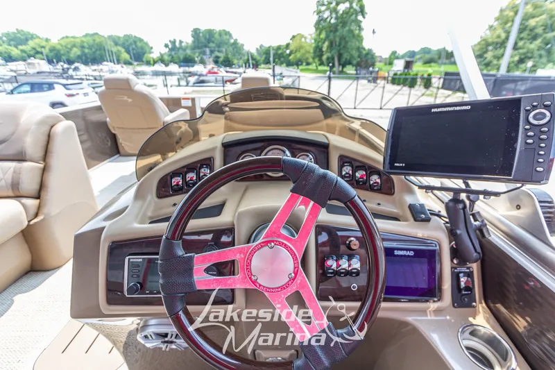 Slide: The Image of Steering console of a 2017 Bennington 22 GFS boat with navigation equipment. - 26
