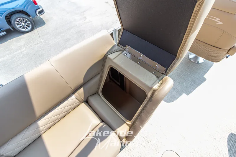 Slide: The Image of 2017 Bennington 22 GFS boat seat with open storage compartment, beige upholstery. - 23
