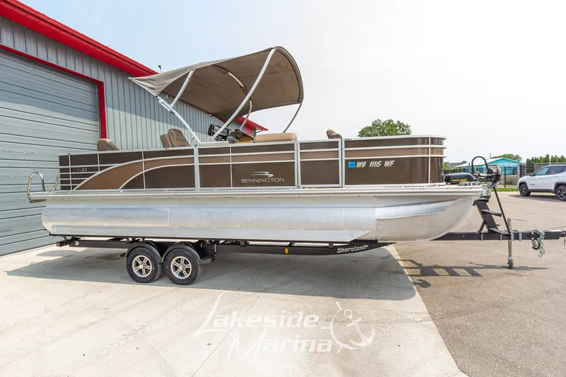 Slide: The Image of 2017 Bennington 22 GFS pontoon boat on trailer at Lakeside Marina. - 2