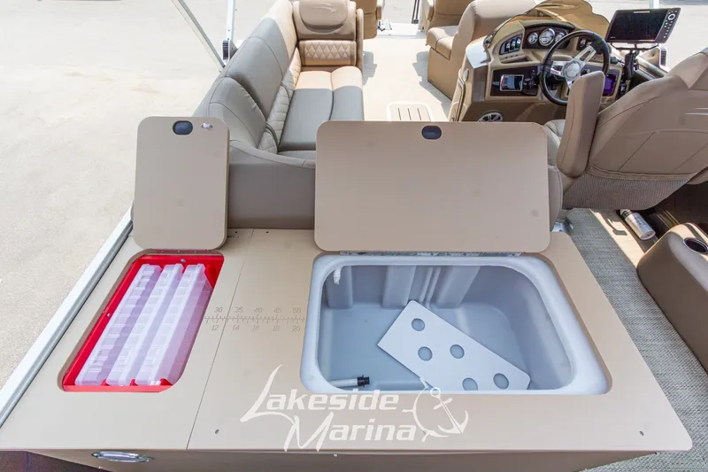 Slide: The Image of 2017 Bennington 22 GFS boat interior with seating, steering console, and storage compartments. - 38