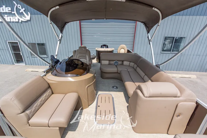 Slide: The Image of 2017 Bennington 22 GFS pontoon boat interior with beige seating and canopy at Lakeside Marina. - 20
