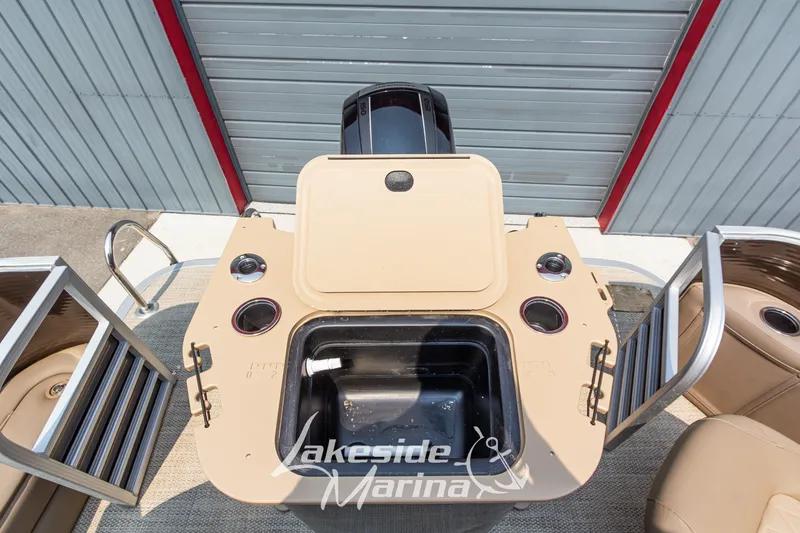 Slide: The Image of 2017 Bennington 22 GFS boat interior with storage compartments and cup holders. - 40