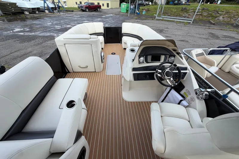 Slide: The Image of 2014 Harris FloteBote Grand Mariner SL 230 interior with luxurious seating and modern dashboard. - 13