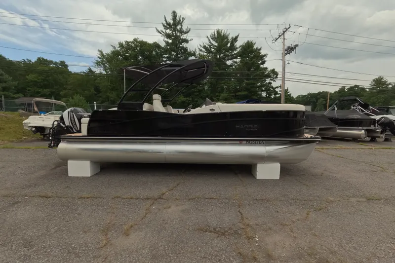 Slide: The Image of 2014 Harris FloteBote Grand Mariner SL 230 pontoon boat on display outdoors. - 4