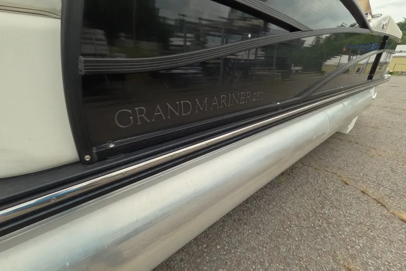 Slide: The Image of 2014 Harris FloteBote Grand Mariner SL 230 pontoon boat side view on pavement. - 5
