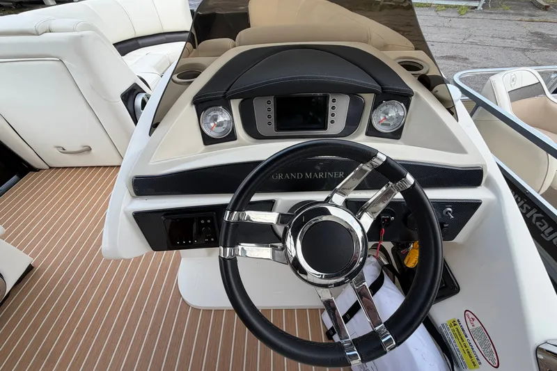 Slide: The Image of Steering console of 2014 Harris FloteBote Grand Mariner SL 230 with modern controls and gauges. - 15