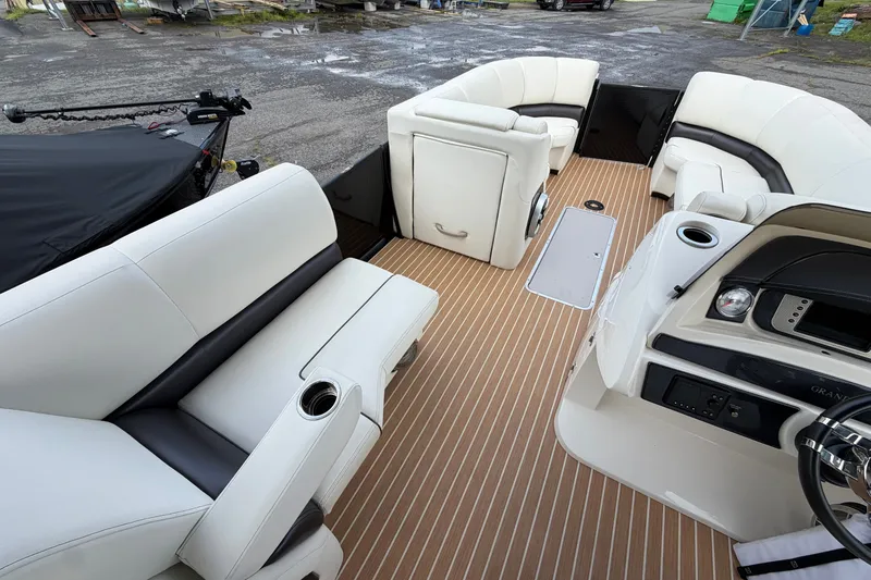 Slide: The Image of 2014 Harris FloteBote Grand Mariner SL 230 interior with white seating and wood-style flooring. - 16