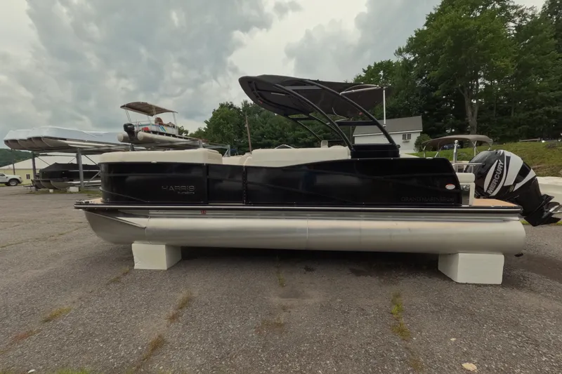 Slide: The Image of 2014 Harris FloteBote Grand Mariner SL 230 pontoon boat on display outdoors. - 3