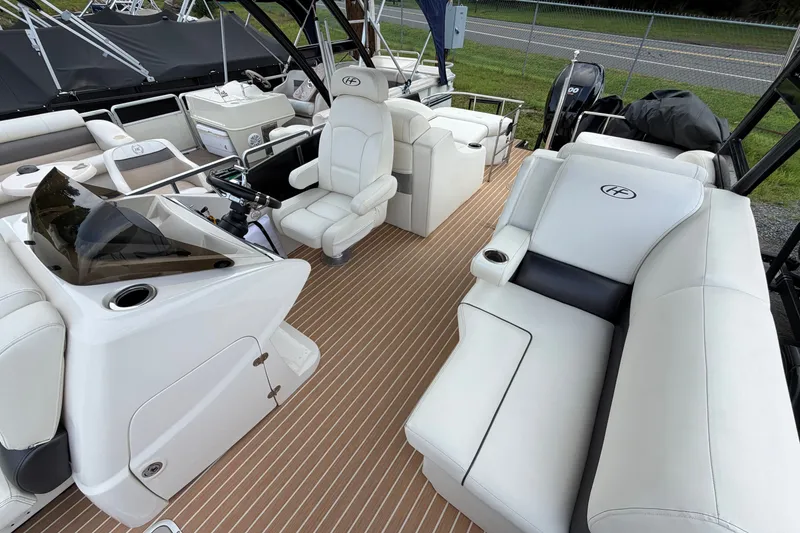 Slide: The Image of Luxurious 2014 Harris FloteBote Grand Mariner SL 230 pontoon boat interior with plush seating. - 12