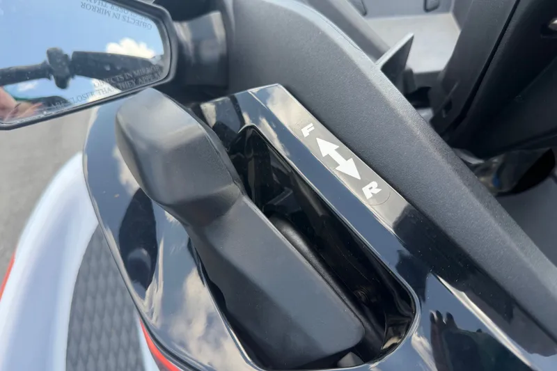 Slide: The Image of Close-up of 2024 Kawasaki Jetski STX 160X throttle control with forward and reverse indicators. - 17