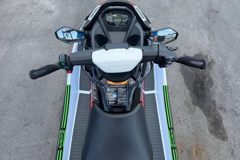 Slide: The Image of 2024 Kawasaki Jetski STX 160X handlebars and dashboard, top view. - 12