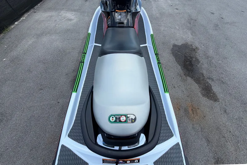 Slide: The Image of A 2024 Kawasaki Jetski STX 160X with a black seat and green accents. - 10