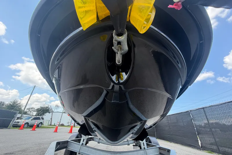 Slide: The Image of 2024 Kawasaki Jetski STX 160X on trailer, viewed from below, with clear sky background. - 9