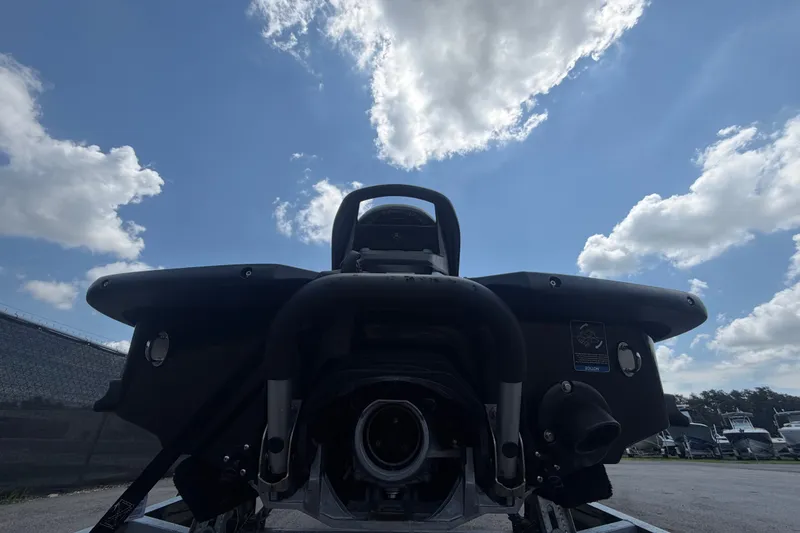 Slide: The Image of 2024 Kawasaki Jetski STX 160X rear view under a bright blue sky. - 4