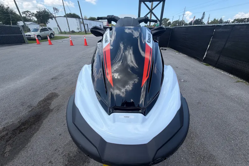 Slide: The Image of 2024 Kawasaki Jetski STX 160X on pavement, front view with red accents. - 8
