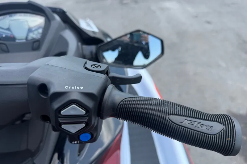 Slide: The Image of 2024 Kawasaki Jetski STX 160X handlebar with cruise control and rearview mirror. - 16