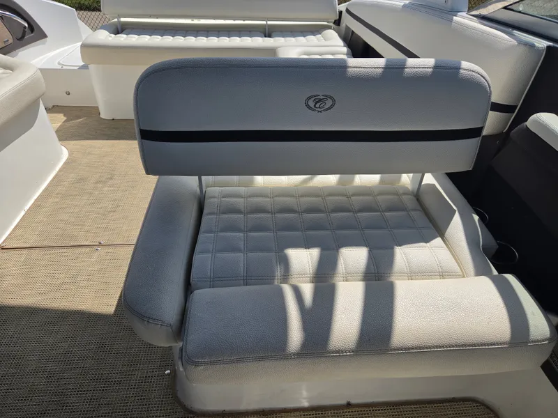 Slide: The Image of A luxurious seat with quilted upholstery and Cobalt logo on a boat. - 13