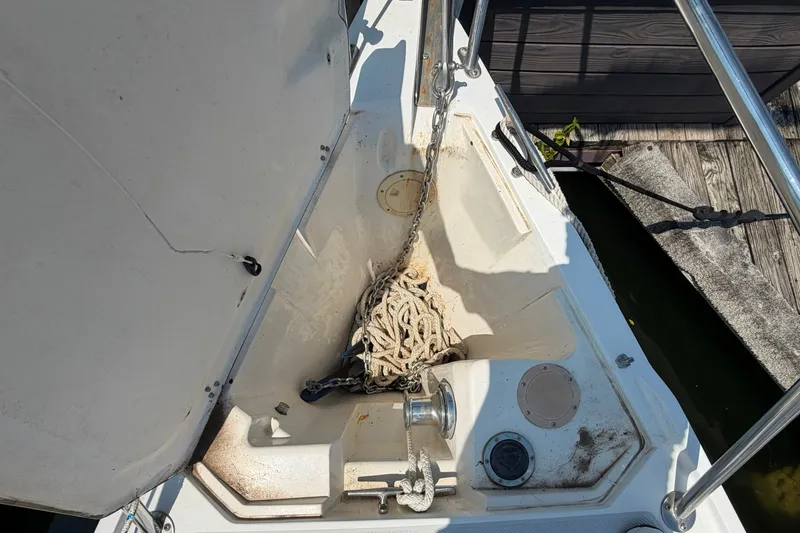Slide: The Image of Anchor locker of a 1997 Catalina 320 sailboat with rope and chain. - 34